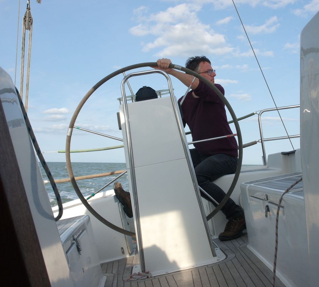 Turning the wheel and looking to windward